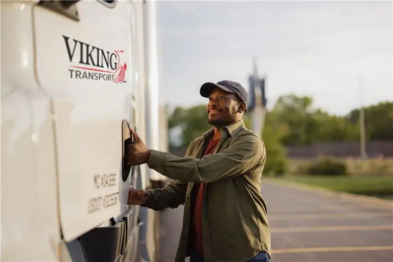 Guy getting into truck with Viking Logo